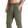 Ny designer Casual man Solid Gym Training Pants Sportkläder Joggare Sportbyxor Män Running Swearing Sweatpants med M-2XL