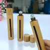 10 ml Bambus Rolle Auf Flasche Mit Roller Glas Kosmetische Container Tragbare Auge Ätherisches Öl Massage Roller Ball Rohr F2935