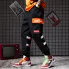 Fashion-Hip-hop casual collision pant colour-tied trousers man armchair trousers, large pockets, loose label-stringing mens cargo pants