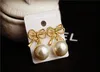 Wholesale- fashion luxury designer cute sweet beautiful geometric bow elegant pearl stud earrings for woman silver pin