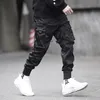 Qnpqyx Novos homens calças de moda fibrons colorido bloco de bolso preto de bolso de bolso harém joggers harajuku suor de hip hop calças253c