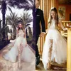 Lång klänningstrand Bröllopsklänningar Brudklänningar Illusion Jumpsuits med avtagbara tåg Lace Appliques Cap Sleeves Tulle Overskirt Pocket Gown