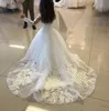 Abiti da ragazza di fiore a trapezio in tulle a maniche lunghe per appliques di pizzo da sposa Abito da prima comunione bianco