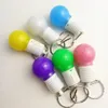 FABRICANTES Ano Festa de Natal New Push Push Fishing Bulb Keychain LED Pingnder Pingente Children's Toys Presente Pingente