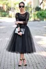 モダンな短い黒いレースティーの長さのイブニングドレス3/4長袖ジュエルラインブラックイブニングドレス