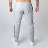 Pantaloni da jogging da uomo Pantaloni da palestra sportivi Pantaloni da jogging da uomo in cotone elasticizzato casual Pantaloni sportivi skinny da uomo Pantaloni da jogging all'aperto con 4 colori