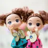 Lindo boneca de menina dos desenhos animados brinquedo, fivela chave 12cm pvc alta simulação, para celebração de casamento, festa garoto 'presente de aniversário, coleta, decotação