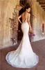 Kitty Chen 2019 Ultimi abiti da sposa a sirena Perline Sexy scollo a V Pizzo Abiti da sposa da spiaggia Sweep Train Abito da sposa Abiti da sposa