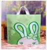 50st Lot Plastic Present Wrap Bag 30 25cm med handtag Flower Cartoon Söt presentpåse Stor shopping Tyg Party Candy Packaging Väskor x238m