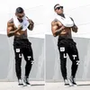 Mäns byxor tryckta jogging män sport kausal sweatpants arbete hip hop gym träningspass streetwear fitness kläder