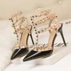 New out Roman fashion sandals Fine high-heeled bright spikesWestern style nightclub fine heels lacquer leather metal