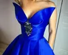 Unikalna zaprojektowana V-Neck Royal Blue Pageant Suknie wieczorowe z kieszeniami Crystal Draped Ball Suknia balowa Sweet 16 Dress Formalna sukienka imprezowa