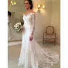 2020 Nuovi abiti da sposa vintage a sirena in pizzo maniche lunghe trasparenti al largo delle spalle Appliques bottoni sul retro abito da sposa lungo treno senza schienale