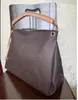 Stilista di moda nero delle donne dell'unità di elaborazione della catena del cuoio dell'oro corpo Messenger bag Croce colore puro femminile spalla della borsa borsa marrone fiore