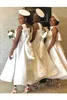 Afrikansk halter satin En linje Short Bridesmaid Dresses 2020 Lace Applique Bow Sash Maid of Honor Dress Wedding Guest Plus Size Dresses BM1901