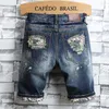 Jeans Shorts pour hommes Couleurs bleues Patch imprimé Pantalons décontractés lavés Fashion Short Ripped For