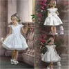 Lovely 2020 Flower Girls Dresses Big Bow Princess Tulle Kortärmad Tjejer Bär för Bröllop Satin Knee Längd Girls Pegeant Dress