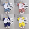 2019 estilo de tendencia de verano de algodón con cuello redondo, patrón de panda de dibujos animados con manga corta y pantalones cortos, dos piezas para niños y niñas