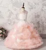 Blush Pink Princess Ragazze Abiti da spettacolo Collo trasparente Perline Abiti da ragazza di fiori per volant da sposa Tulle Lunghezza pavimento Bottoni Abito da bambino posteriore