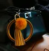 2020 NYA PU Läderarmband Nyckelringar Cirkel Söt solid färgpäls Pompom Tassel Wristlet Keychain för kvinnor Tjej Smycken