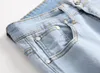 Mens Jeans Mens Blue Ripped Distressed Motorcykelbyxor Vikar Hål Zipper Design Elastisk tvättad retro high street mode denim