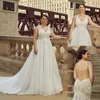 Robes de mariée grande taille sexy col en V dentelle Appliques robes de mariée plage balayage train robe de mariée dos nu