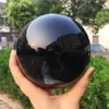 2020 1pcs Natural heavy Natural Black Obsidian Sphere Large Crystal Ball Healing Stone Foe Home Decoration317t