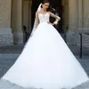 A line wedding dress sheer neck long sleeves lace appliques top tulle bridal gowns with sweep train custom made