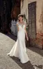 2020 nuovi abiti da sposa a sirena economici Sheer Scoop Neck Cap maniche in pizzo Appliques Button Back Sweep Train Plus Size Abiti da sposa formali