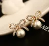 Fashion exquisite zircon bow pearl Stud earrings highgrade 18K goldplated hypoallergenic female cute girl earrings9125697