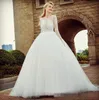 2019 Long Sleeves Ballgown Wedding Dresses Sheer Neck Lace Applique Sweep Train Chic Illusion Covered Buttons Back Wedding Bridal Gown