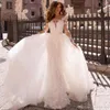 Seksowne suknie ślubne Seksowne Syrenki Sheer Neck See przez Długie Rękawy Aplikacje Suknie ślubne z odpinanym pociągu Vestidos de Soiree