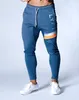Nouveaux hommes joggeurs pantalons décontractés Fitness pantalons de survêtement Sport crayon pantalon coton gymnases pantalons d'entraînement mâle maigre piste