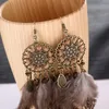 Nouveau Style attrape-rêves Vintage grand creux en métal fleur feuille boucle d'oreille pour les femmes longues plumes glands boucles d'oreilles bijoux