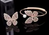 Varm försäljning Högkvalitativ ihålig och mousserande zircon-inlaid armband pärla fjäril Öppna armband Deluxe smycken för kvinnors bröllop