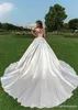 Eleganta vita spetsar bröllopsklänningar Ny senaste Hot Sale Cap Sleeve A-Line Appliques Beaded Button Back Heer Bridal Gowns Vestidos de Nnovia