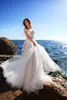 Sheer Bateau Beach Suknie ślubne Koronkowe Aplikacje Bohemia Suknie ślubne z Tassel Criss Cross Back Plus Size Wedding Sukienka