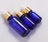 Flacons compte-gouttes en verre bleu, 5ml, 10ml, 15ml, 20ml, 30ml, 50ml, 100ml, vente en gros, récipients vides pour huiles essentielles et cosmétiques avec couvercle doré