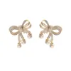 Orecchini con fiocco di perle creative per le donne Orecchini con nappe corti di nuova moda gioielli placcati in oro con pietra CZ