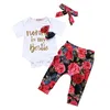 Set di abbigliamento floreale per bambina, top stampato con lettere a maniche corte, pantaloni floreali, fascia per capelli, abbigliamento firmato per bambina