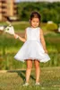 2020 Breve Puffy Nuova Cheap Flower Girl Dresses per Matrimoni Jewel maniche cerniera posteriore con l'arco ragazze vestito da spettacolo Bambini Comunione abiti
