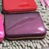 Toppkvalitet Fashion Patent Leather Short Wallet Plånbok för Lady Shinny Leather Card Holder Coin Purse Women Wallet Classic Zipper 2468778