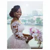 Sexy African A Line Wedding Dresses Scoop Neck Illusion Full Lace Pearls Beaded Long Sleeves Chapel Train Ball Gown Formal Bridal Gowns