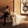 Sexy A-line Wedding Dresses Off-shoulder 1/2 Long Sleeve Appliqued Lace Tassel Bridal Gown Backless Sweep Train Custom Made Robes De Mariée