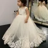 Beautiful Flower Girl Dresses Jewel 2019 Abiti da Pageant con pizzo Applique A-Line Sashes Abiti da partito formale a pavimento su misura