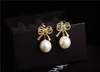 Wholesale- fashion luxury designer cute sweet beautiful geometric bow elegant pearl stud earrings for woman silver pin