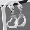 Boucles d'oreilles à la mode en céramique creuse géométrie boucles d'oreilles Bling cristal papillon joli coeur boucles d'oreilles douces pour femmes cadeaux bijou