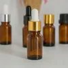 10ml Amber Glass Dropper Flessen voor essentiële olie met zwarte gouden dop voor cosmetische pakket Gratis verzending