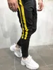 Mode-Herren Designer Street Pantalones Hosen Gestreifte Knöpfe Design Bleistift Haremshosen Lässige Sport Jogger