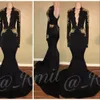 Sexiga svarta balklänningar Deep V -halsen med guldspetsapplikationer sjöjungfru långa ärmar rygglösa afrikanska sveptåg vestidos kvällsfest klänningar